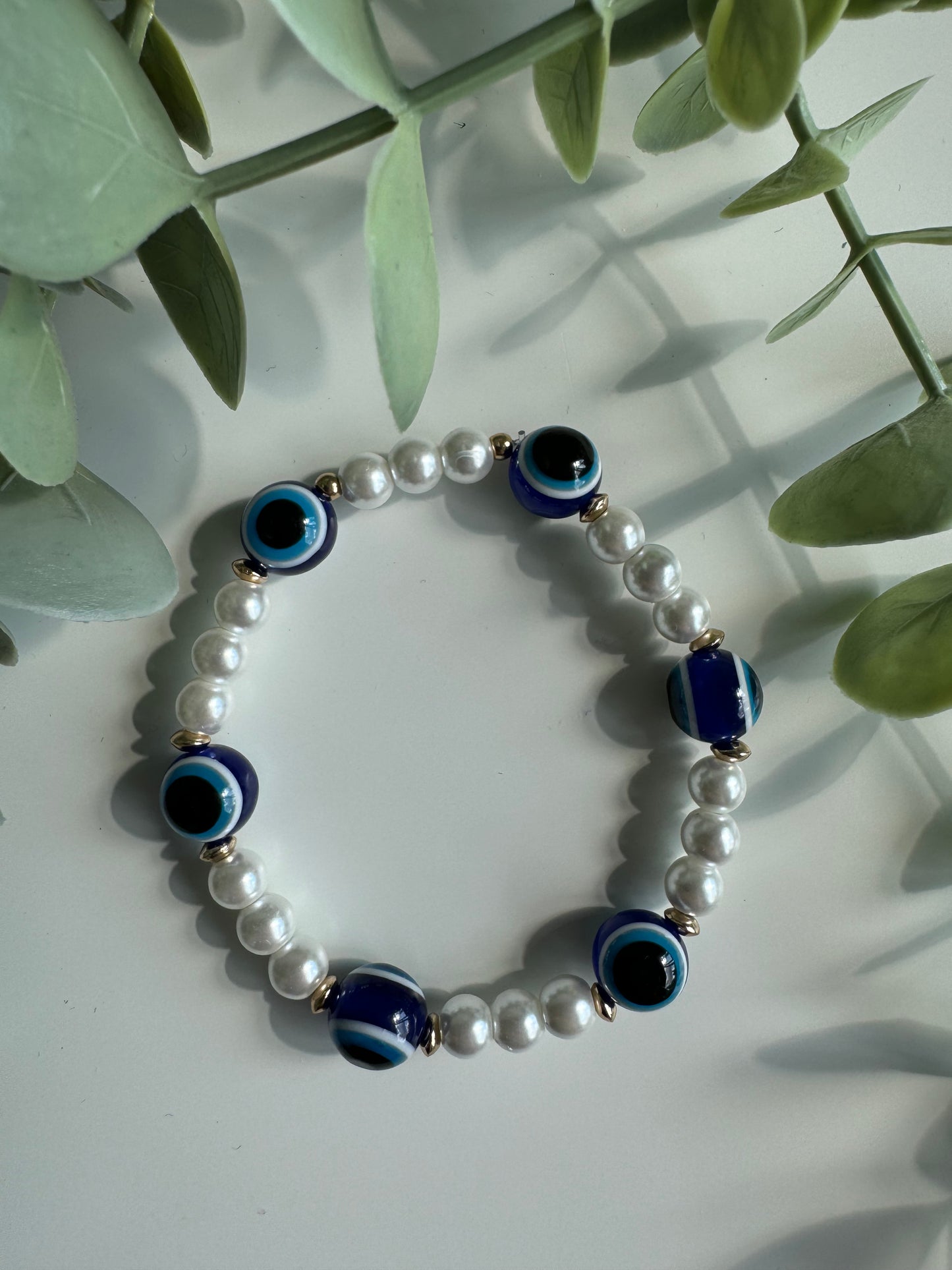 Evil eyes and pearls bracelet.