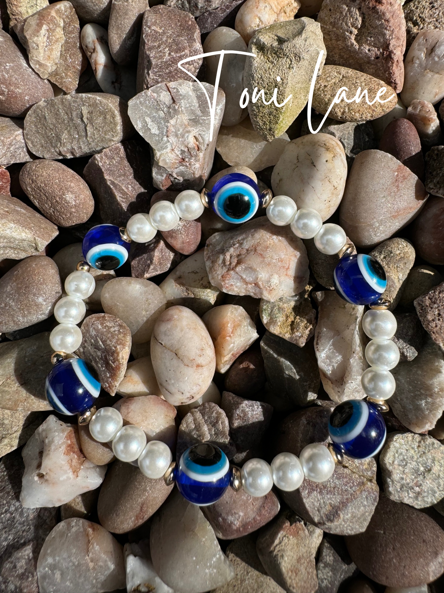 Evil eyes and pearls bracelet.